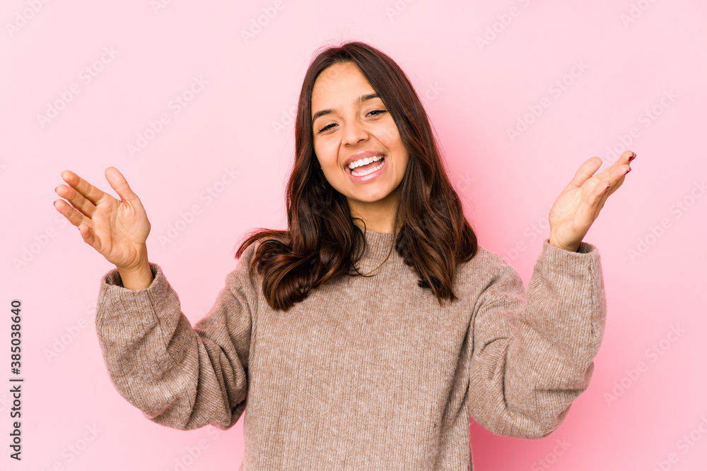 Young mixed race hispanic woman isolated celebrating a victory or success, he is surprised and shocked. Young mixed race hispanic woman isolated celebrating a victory or success, he is surprised and shocked.