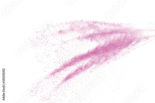 Freeze motion of pink color powder exploding on white background. 