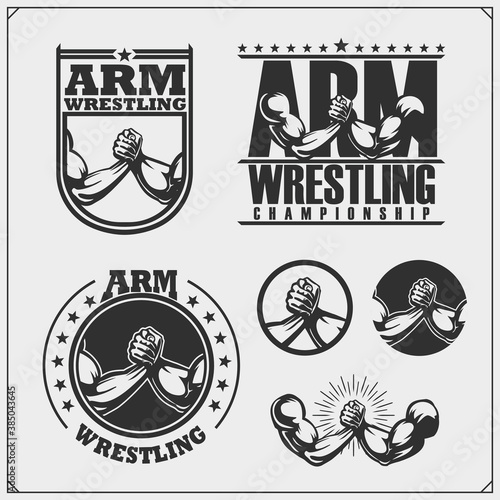 Set of arm wrestling club emblems, labels, badges and design elements. Print design for t-shirts.