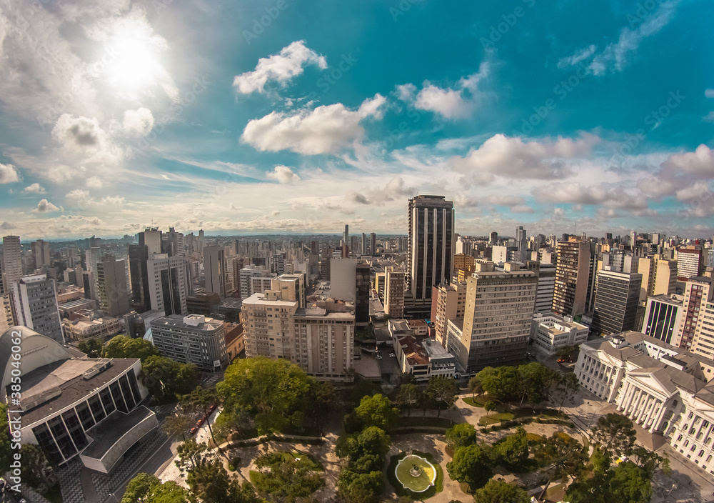 Aerial wide-angle landscape view of urbanized center with colorful skyscrapers in the morning - Santos Andrade Square - Curitiba, capital of Paraná State, Brazil - obrazy, fototapety, plakaty 