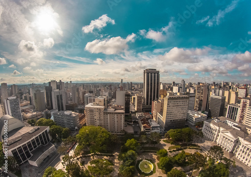 Aerial wide-angle landscape view of urbanized center with colorful skyscrapers in the morning - Santos Andrade Square - Curitiba, capital of Paraná State, Brazil photo