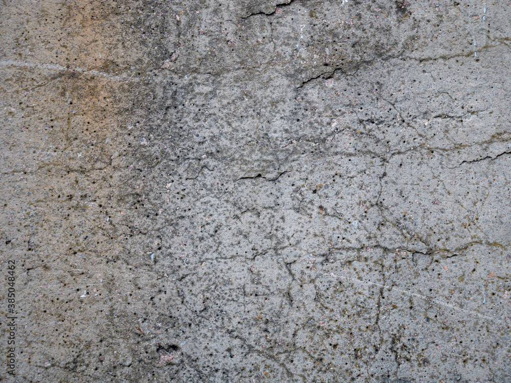 Fototapeta premium Texture of old reinforced concrete with protruding rusty rebar and moss