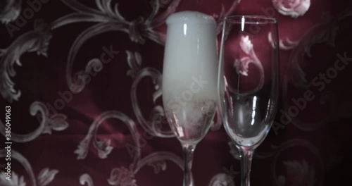 Pouring champagne into a glass photo