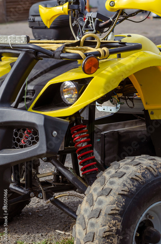 Front of  yellow electric ATV.