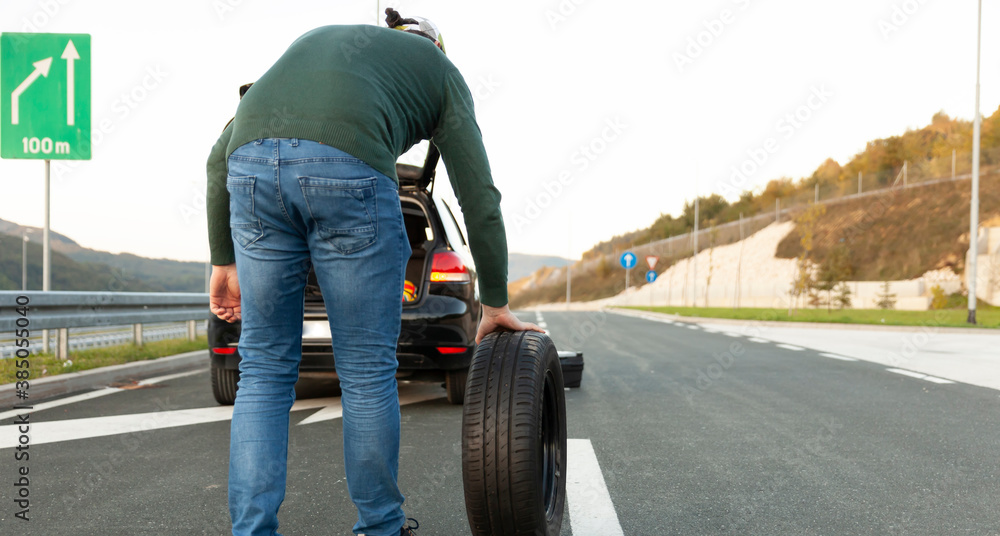 The driver talks on the phone, calls for help on the road. A problem on the trip The driver talks on the phone, calls for help on the road. A problem on the trip