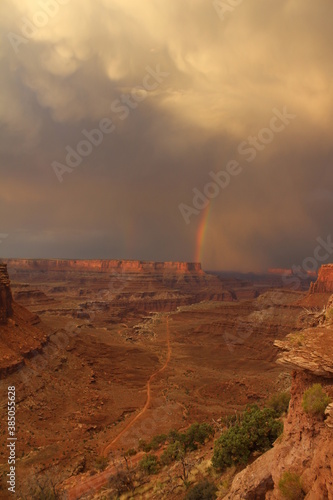 Rare view of a double rainbow coming over the massive Shafer Canyon in Canyonlands National Park, Utah at sunset. © Austin
