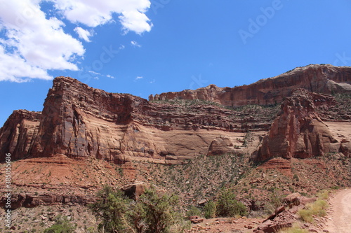 A scenic drive through a gorgeous desert landscape in Shafer Cayon, Canyonlands National Park, Utah