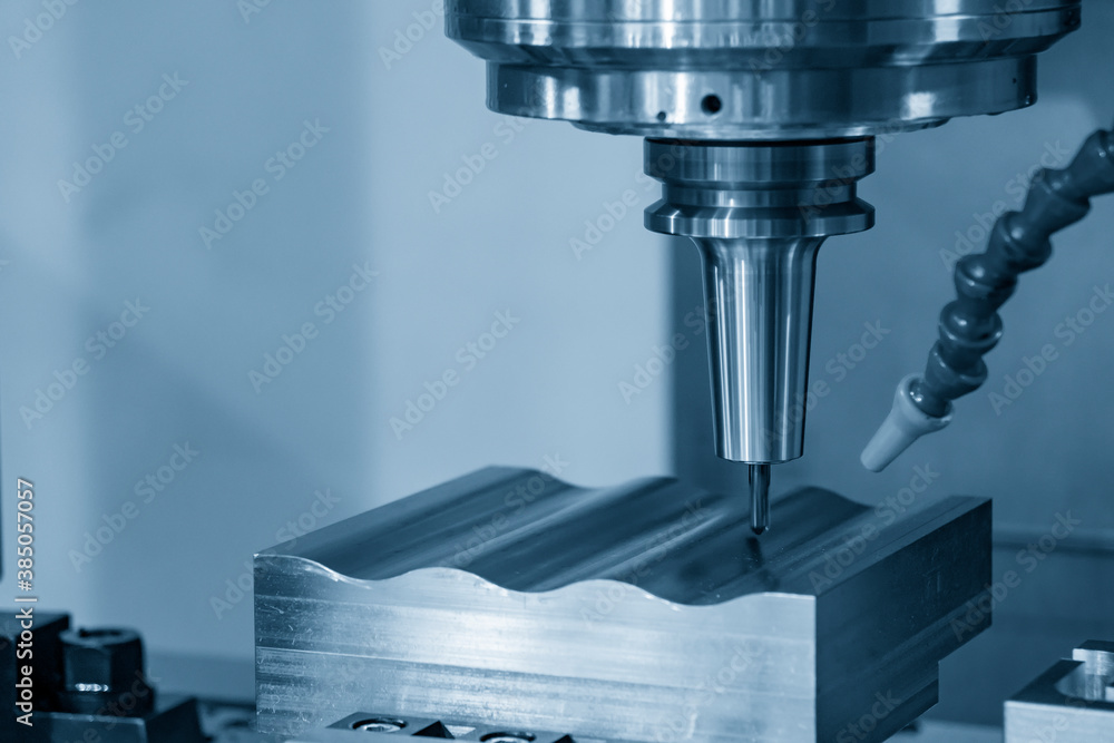 The CNC milling machine cutting the mold parts by solid ball end-mill tool. The hi-precision mold and die manufacturing concept by machining center. The CNC milling machine cutting the mold parts by solid ball end-mill tool. The hi-precision mold and die manufacturing concept by machining center.