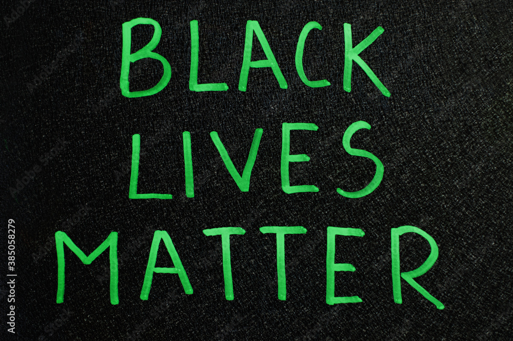 Black lives matter. Inscription green words on board. Black lives matter. Inscription green words on board.