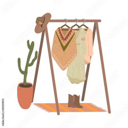 Rail and hangers for feminine boho style clothing, footwear and hat