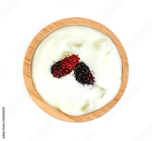 yoghurt with nata de coco dutchie and mulberries fruit in wooden bowl isolated on white background photo