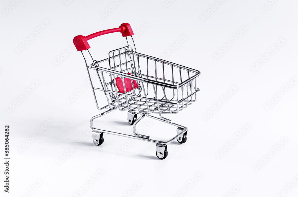 red empty cart on a white background close up concept of trade