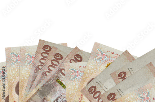 1000 Thai baht bills lies on bottom side of screen isolated on white background with copy space. Background banner template photo