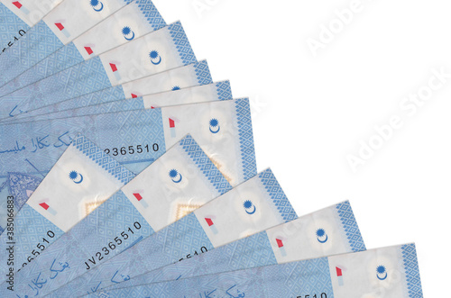 1 Malaysian ringgit bills lies isolated on white background with copy space stacked in fan close up photo