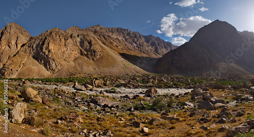 Central Asia. Tajikistan. Rocky banks of a tributary of the border river Panj on the border with Afghanistan.