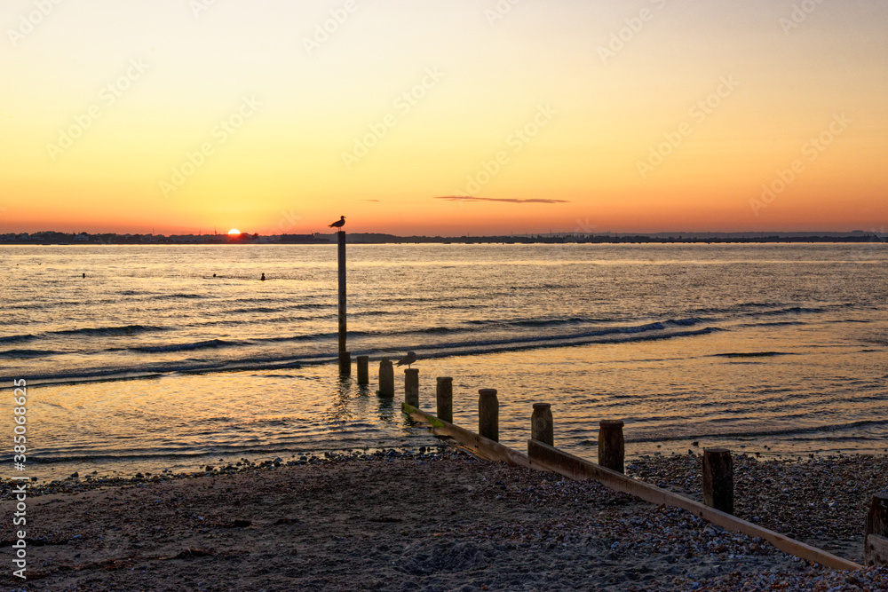Obraz premium Dramatic sunset over West Wittering beach