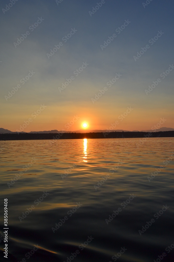 Fototapeta premium Beautiful landscape with clouds over tequesquitengo lake at sunset
