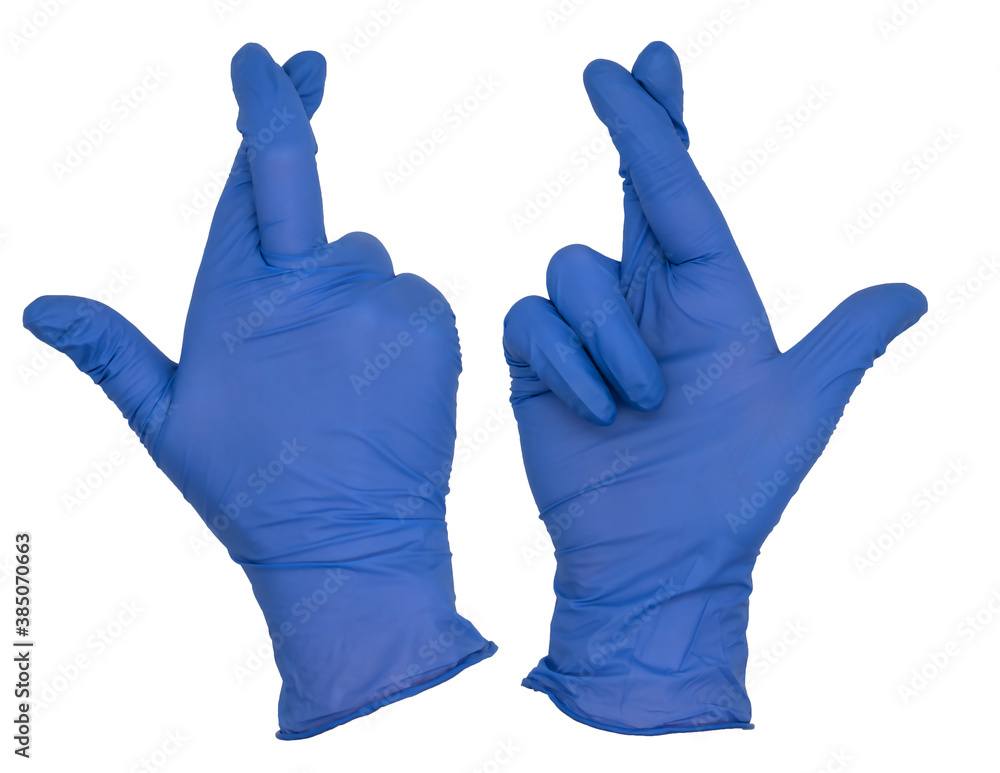 Hand wearing blue nitrile examination glove makes fingers crossed gesture. Front and back view Hand wearing blue nitrile examination glove makes fingers crossed gesture. Front and back view