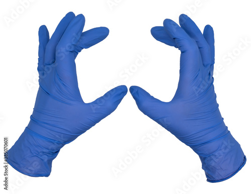 Hands wearing blue nitrile examination gloves held apart, fingers gently curled, palms together. Female hand isolated, no skin