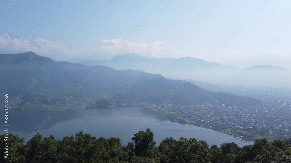 Sweeping vista pan of Pokhara Nepal with Annapurna mountains beyond Sweeping vista pan of Pokhara Nepal with Annapurna mountains beyond