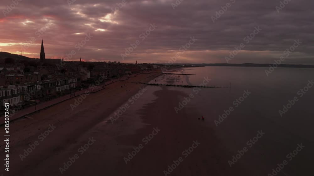 Beautiful Portobello Beach in Edinburgh during dramatic sunset-Aerial flying forward Beautiful Portobello Beach in Edinburgh during dramatic sunset-Aerial flying forward