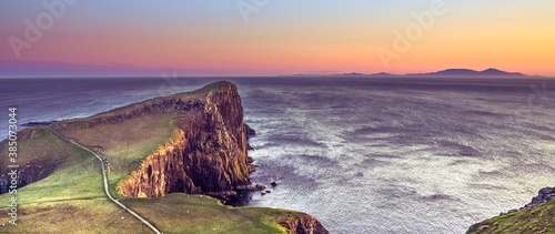 Wonderful sunset at the Neist point lighthouse in Scotland photo