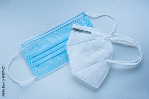 Respirator and medical protective mask on a blue background