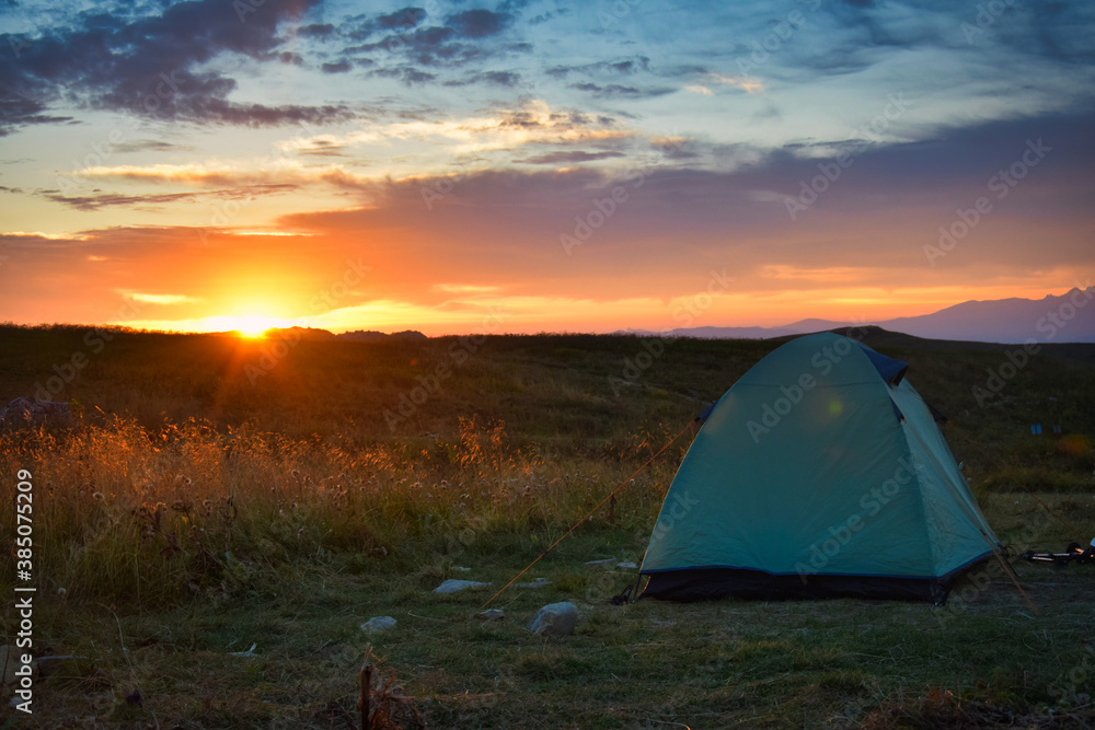 Sunrise over a tourist tent at the Lagonaki plateau