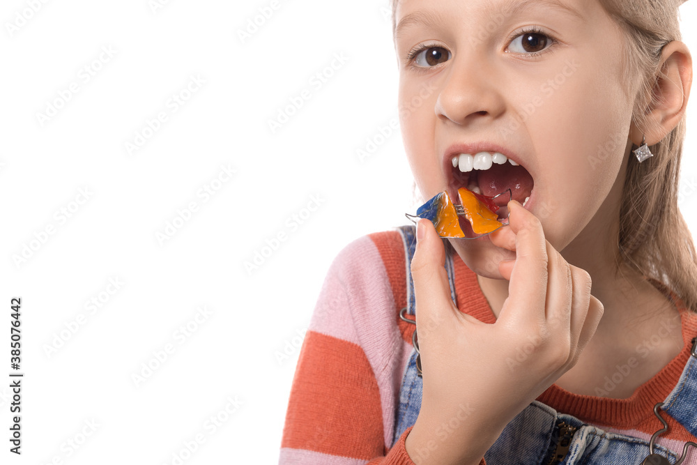 Little girl with orthodontics appliance isolated on white background. Little girl with orthodontics appliance isolated on white background.