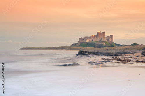 Bamburgh Castle in Northumberland at sunset - view from the beach