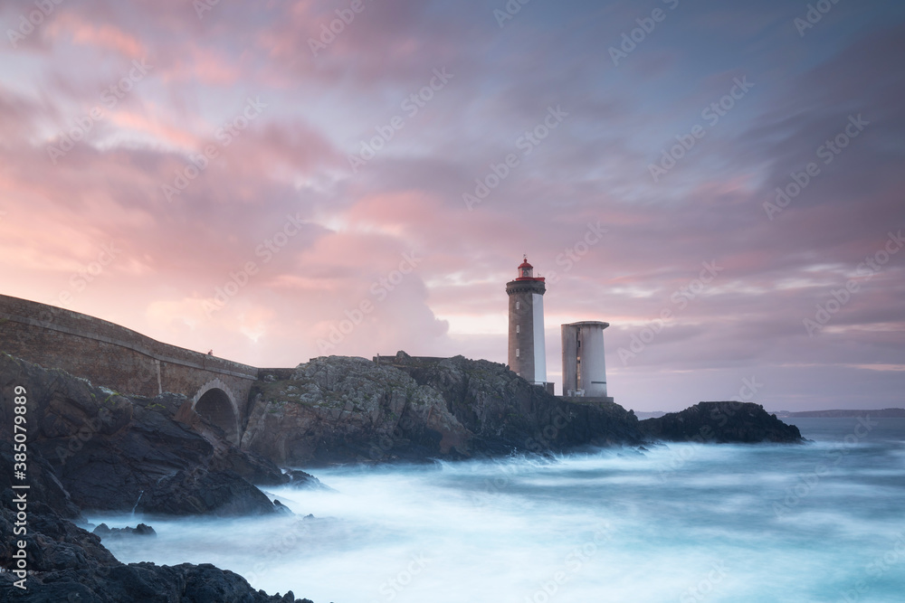 Most popular lighthouse in Europe during stormy weather. Petit Minou Lighthouse at sunset with red light, Brest , France View of Lighthouse of Petit Minou in Brittany. Summer season, France coastline