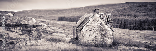 An old abandoned house on a farm yard photo