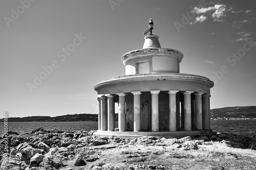 The historic St. Theodora lighthouse on the island of Kefalonia, Greece, black and white 