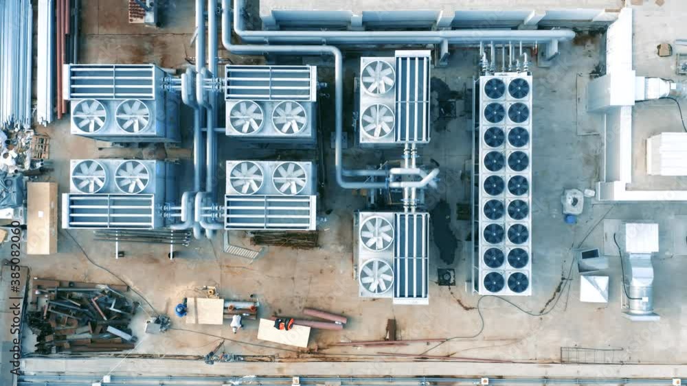 Ventilation and air conditioning systems installed on the rooftop. Aerial top down view Ventilation and air conditioning systems installed on the rooftop. Aerial top down view