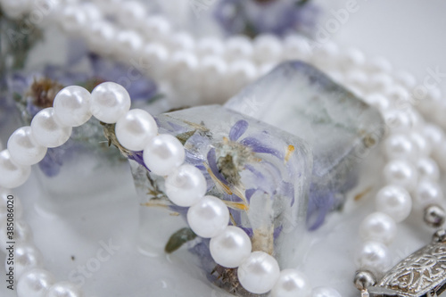 pearl necklace on a white background © Ирина Курмаева