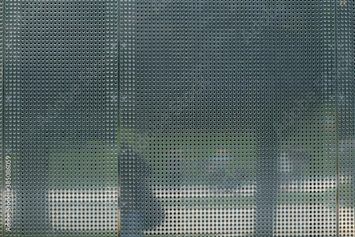 Perforated metal. Metal background with round hole perforation. For design