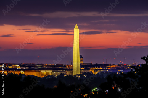 Washington Monument at sunrise with orange and purple clouds in the background Washington DC, USA 