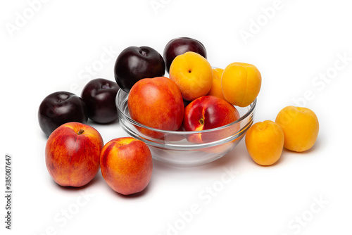 nectarine  peach and plum on a white background