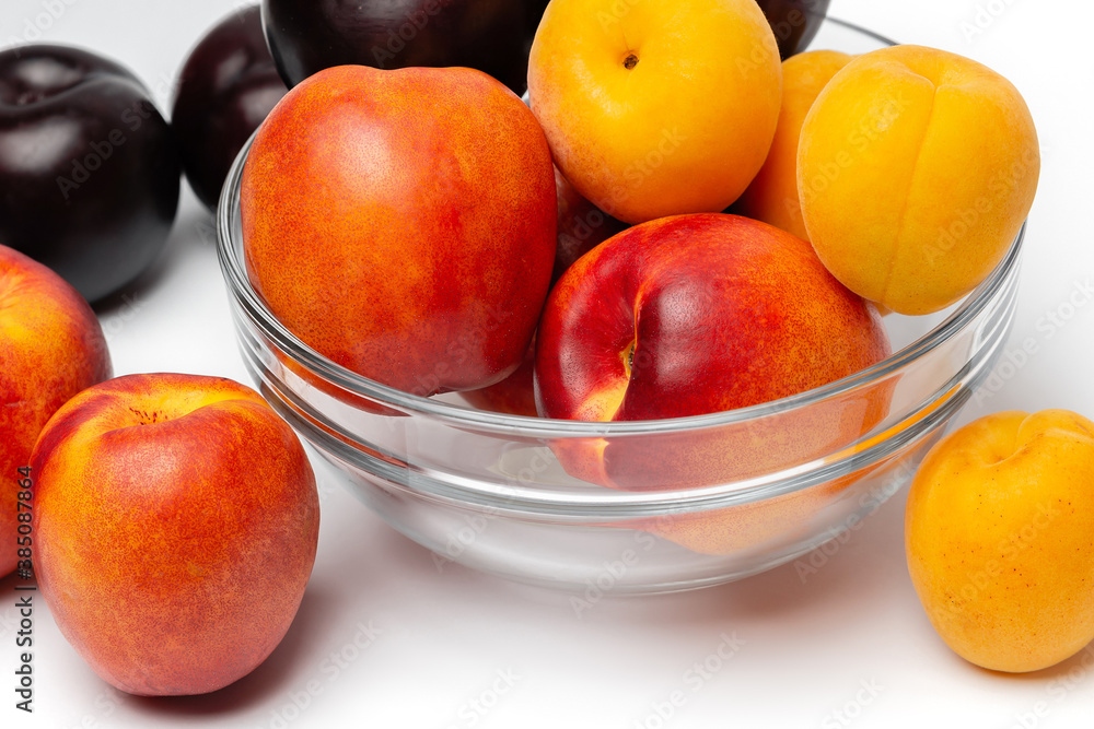nectarine, peach and plum on a white background nectarine, peach and plum on a white background