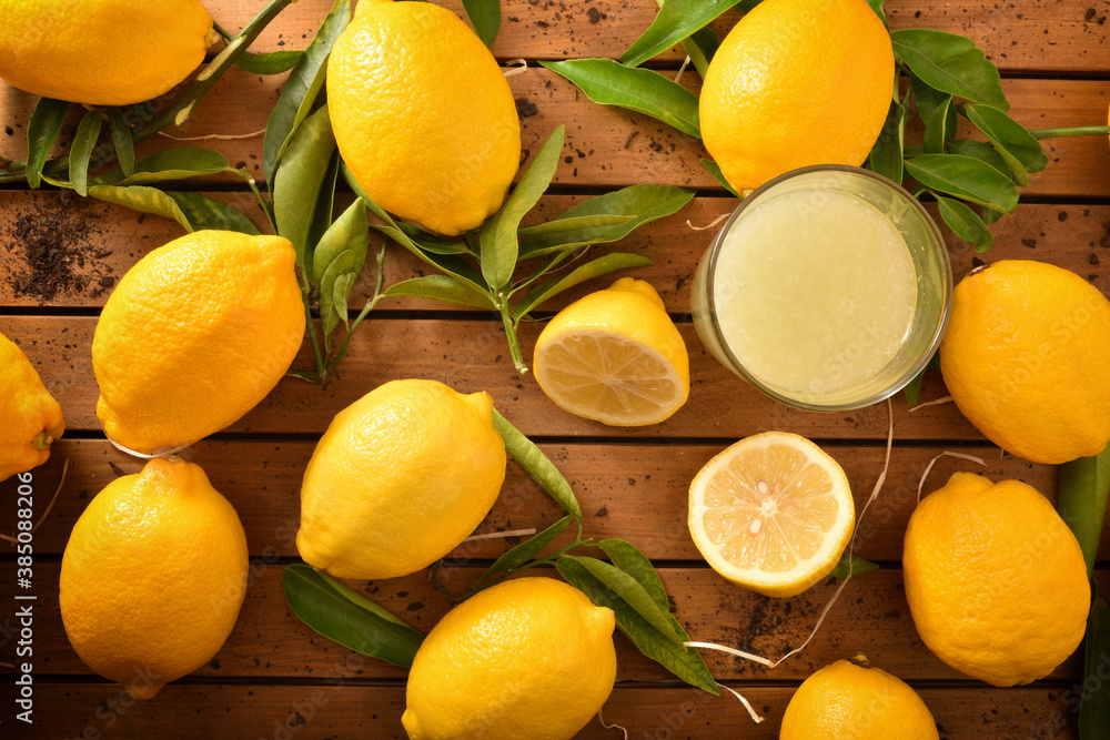 Background with freshly squeezed juice on wooden table top
