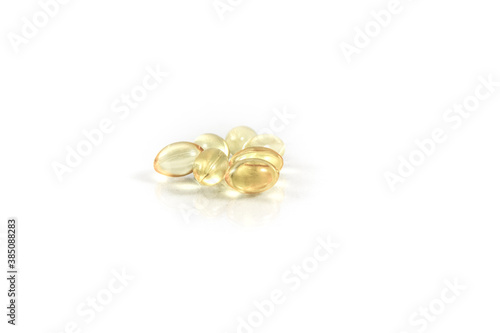 Yellow pills isolated on white background