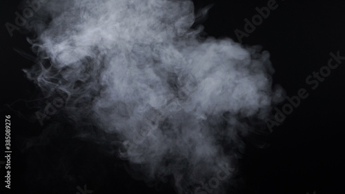 Smoke of electronic cigarette on black background