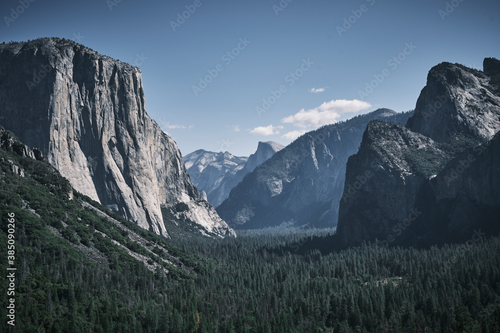 A panoramic view of the Yosemite Valley in California on a sunny day. On the left El Capitan rock. 