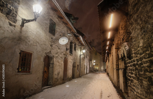 The st Catherine s passage - one of the most picturesque lanes of Old Tallinn and Unesco cultural heritage site at the heavy winter snowfall night