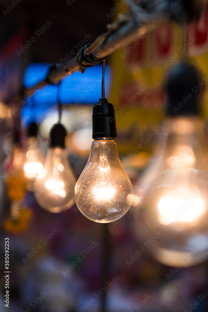 old light bulb glowing in market