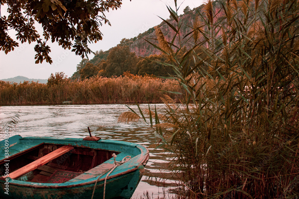 Romantic autumn background, Boat in the river, 