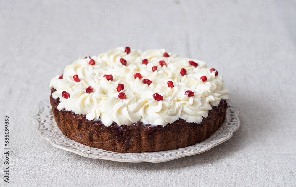 Honey cake with mascarpone cream and pomegranate seeds Honey cake with mascarpone cream and pomegranate seeds