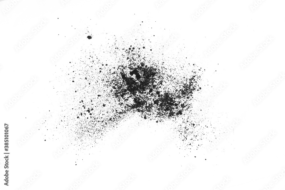 Black powder (Charcoal powder) scattered. Isolated on white background. A loose heap of fine Powdered charcoal. 