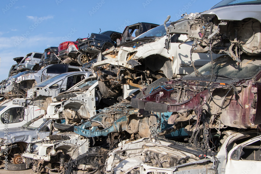 cars waiting to be recycle in junk yard in Turkey, Ankara - stacked cars in car cemetery - auto graveyard