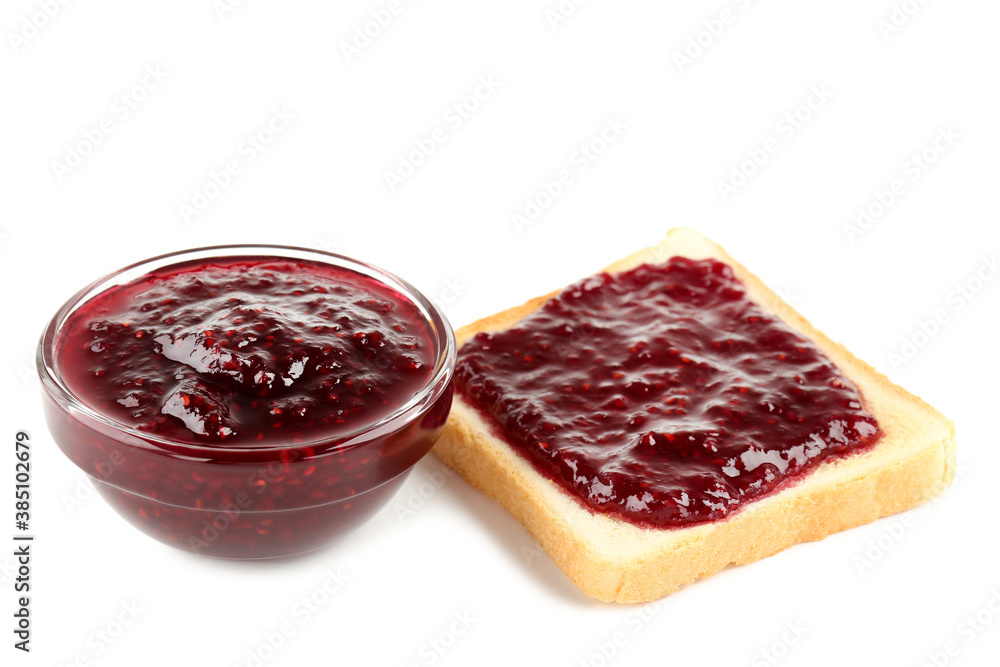 Toast and bowl with raspberry jam isolated on white background